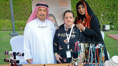 Dr. Shafiqa Al Ameri and Murshid Al Shamsi with one of the people of determination IMG 1